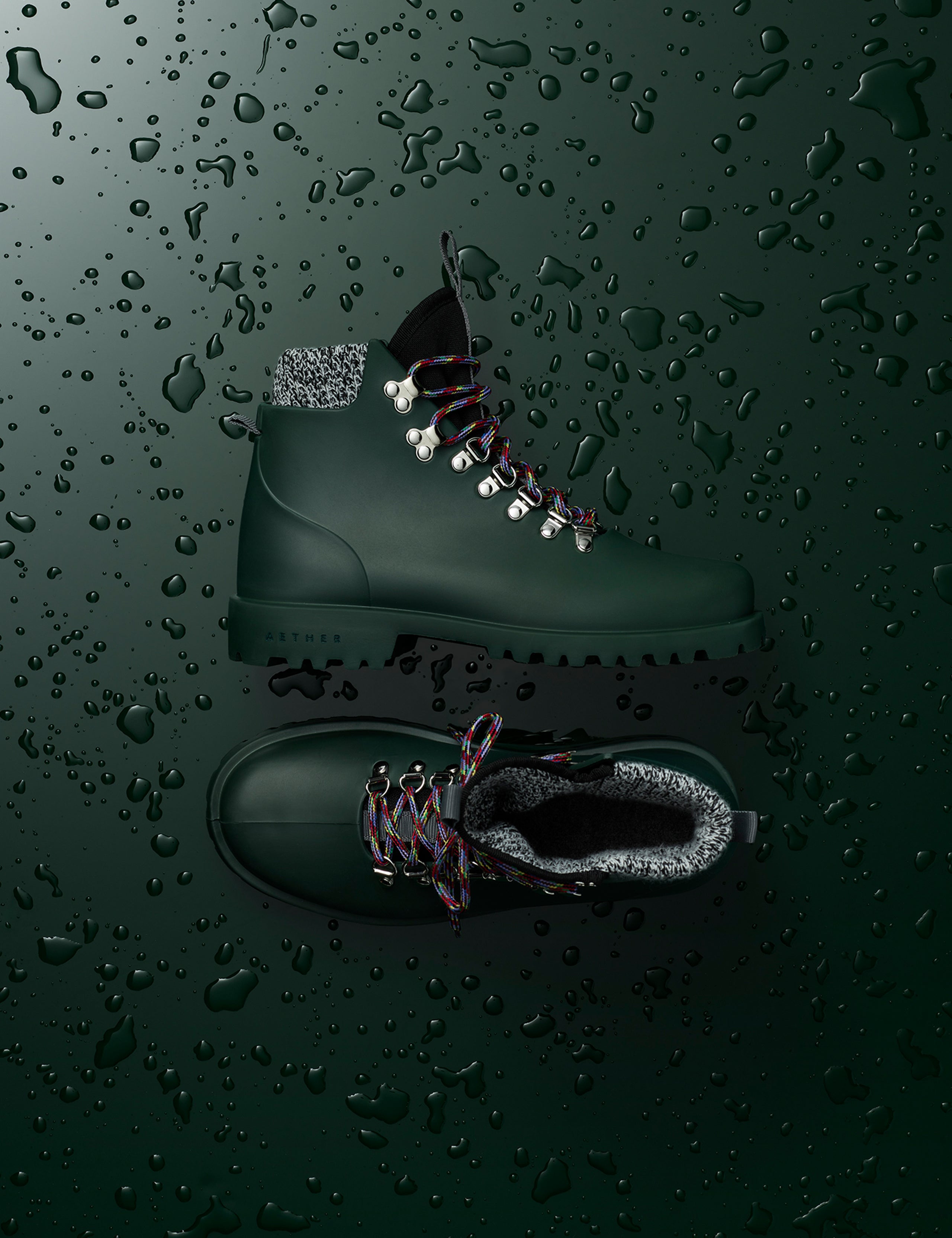 Flat lay view of women's Rain Boot in Dark Green from AETHER Apparel. 