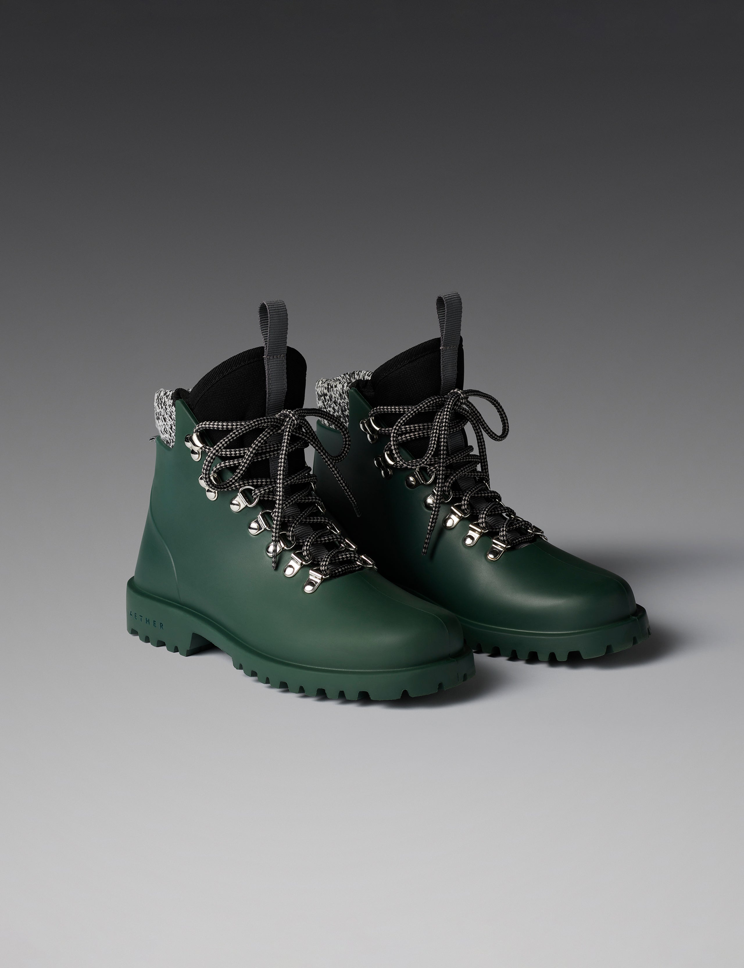 Front angled view of women's Rain Boot in Dark Green from AETHER Apparel. 