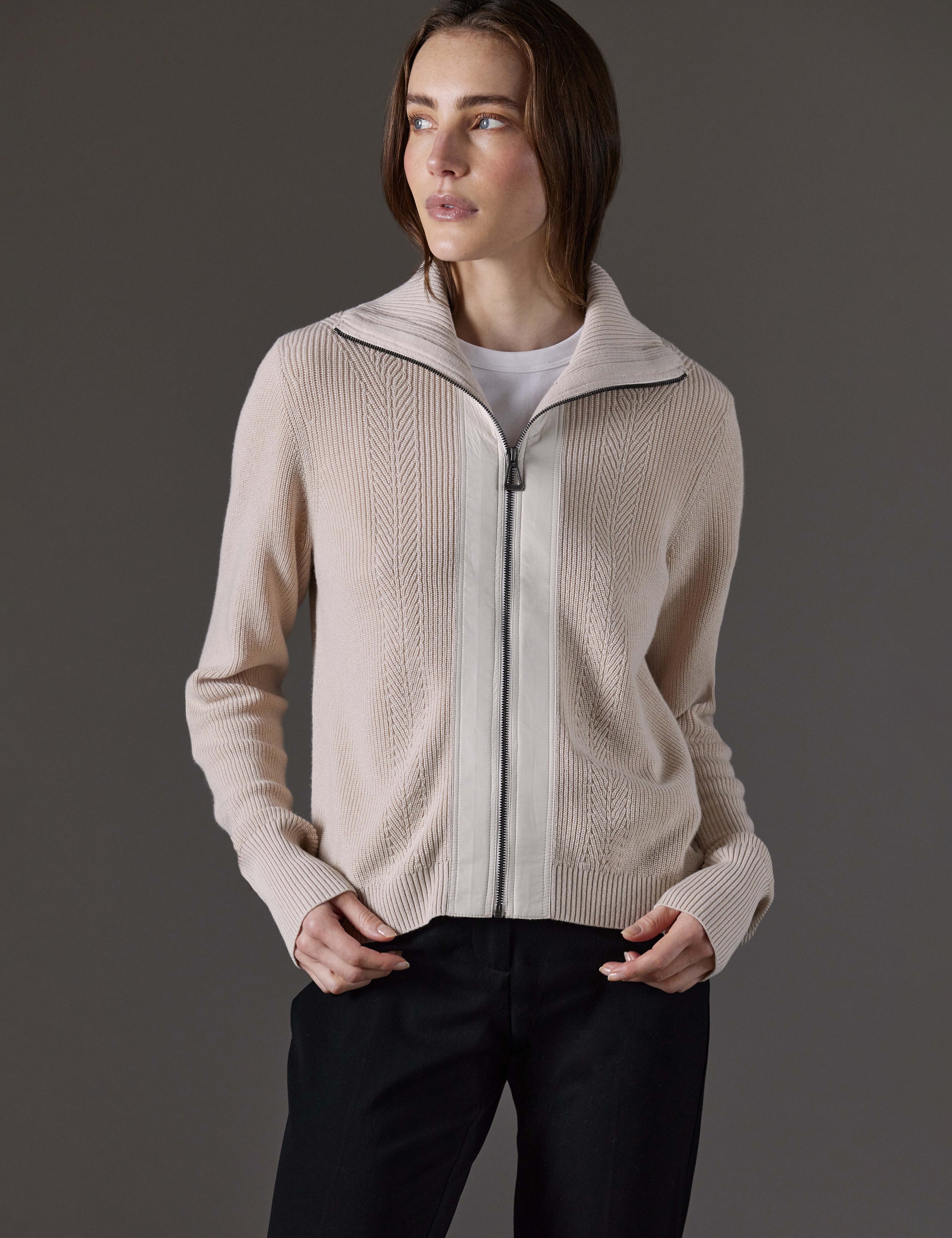 Front view of woman wearing Rhea Full-Zip Sweater in Bone white from AETHER Apparel.