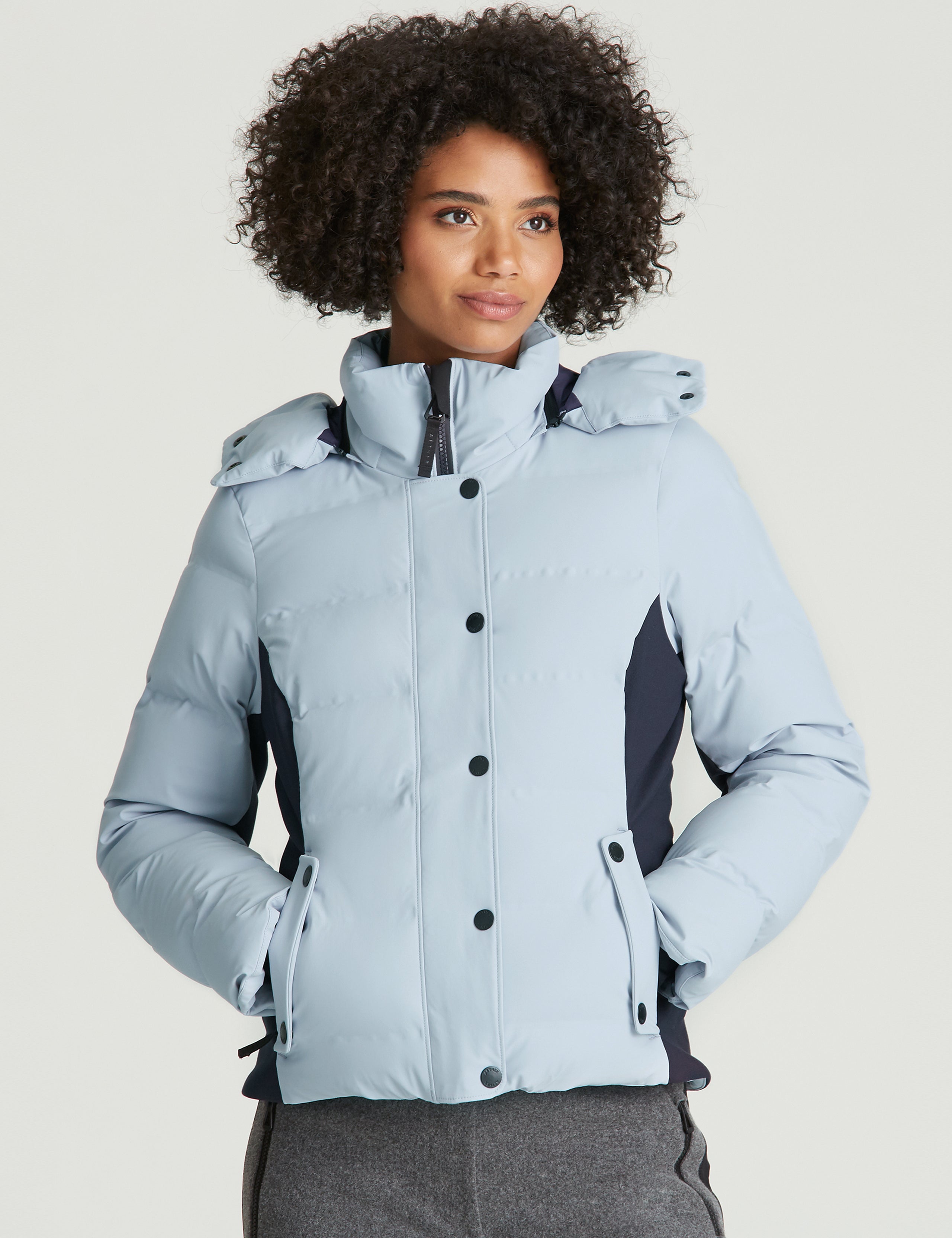 Front view of woman wearing Torino Jacket in Vista Blue from AETHER Apparel.