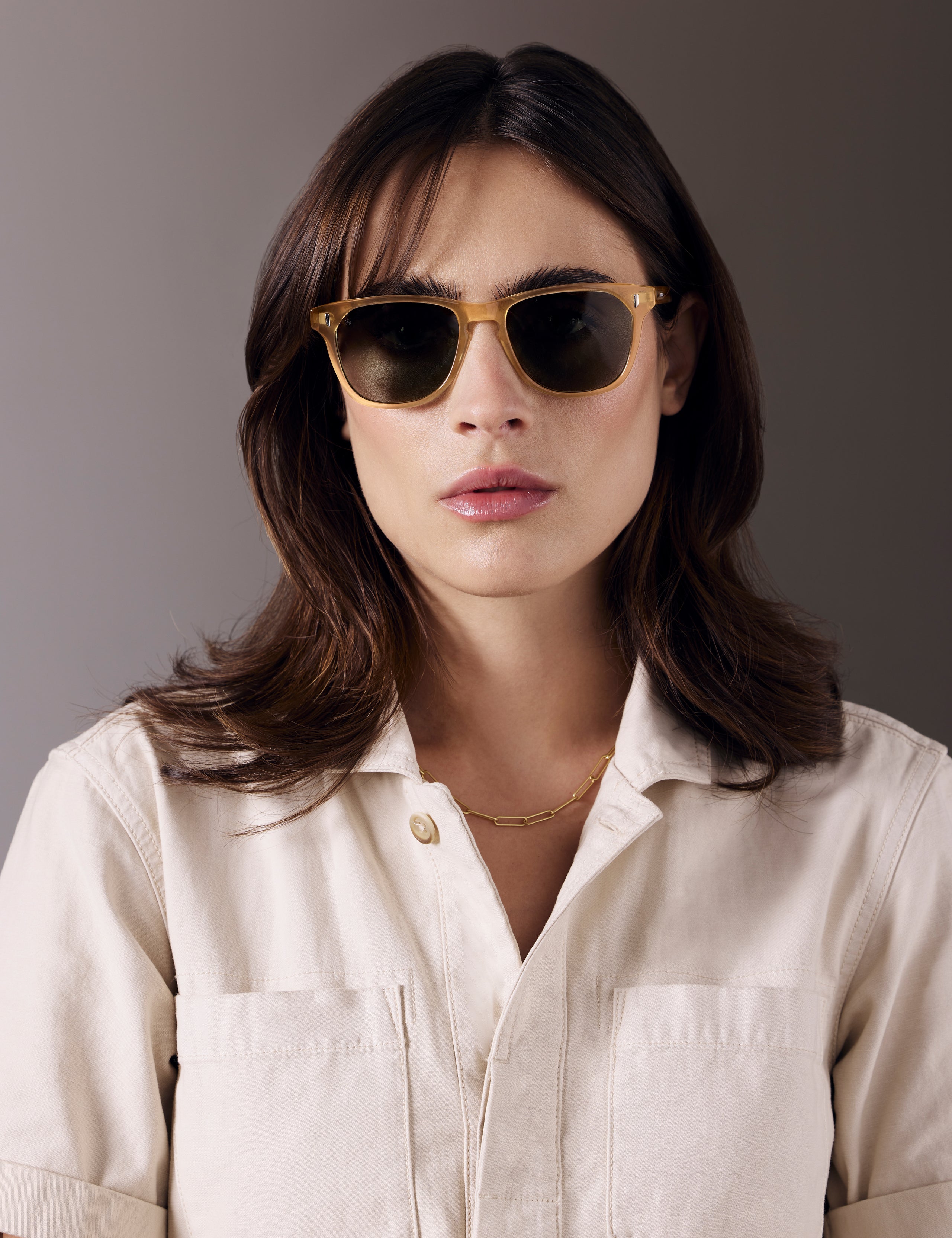 Front view of woman wearing Yosemite Sunglass in Honey with G15 Lens from AETHER Apparel.